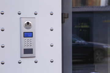 Video intercom in the entry of a house, technology and security concept.