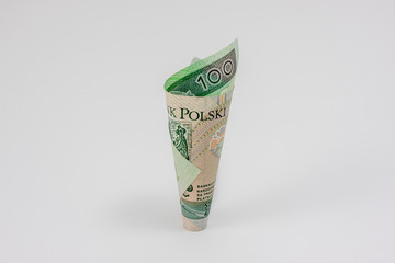 A one hundred Polish zloty banknote in the shape of a cone