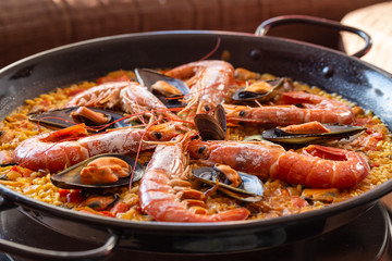 delicious spanish paella served on the typical pan