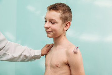 healing bloodletting hijama or phlebotomy hajam master conducts cupping therapy on a young man