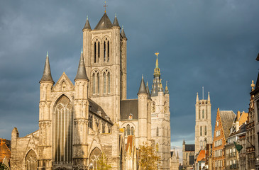 Fototapeta na wymiar Ghent city historical center with Saint Nicholas cathedral facade, Belfry and saint Bavo's cathedral in the background, Flemish Region, Belgium
