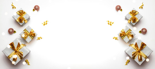 Xmas background. gold Christmas gifts, ornaments on dark background. Winter holiday present. Merry Christmas and Happy Holidays greeting card, frame, banner