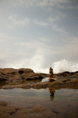 Rock stack against breaking waves 2