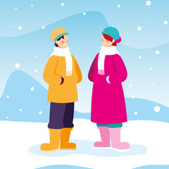 couple of people with winter clothes in landscape with snowfall