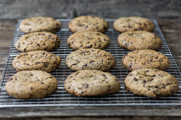 Freshly Baked Chocolate Cookies on Cooling Rack. Sweet Biscuits. Homemade pastry.