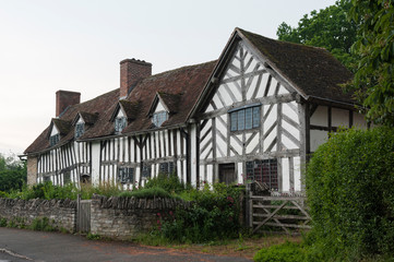 Fototapeta na wymiar STRATFORD-UPON-AVON, ENGLAND - MAY 27, 2018: Ancient historic home and farm of Mary Arden, mother of William Shakespeare, built around the 15th century in the village of Wilmcote - UK