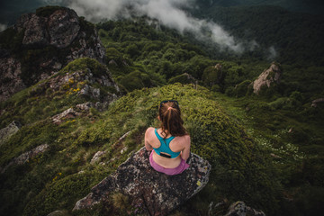 young woman in the mountains