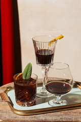 Negroni cocktail garnished with sage leaf, red vermouth and Porto, fortified wine from italy and Portugal