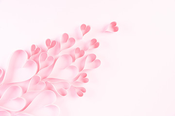 Pink paper hearts on Light pink pastel paper background. Love and Valentine's day concept.