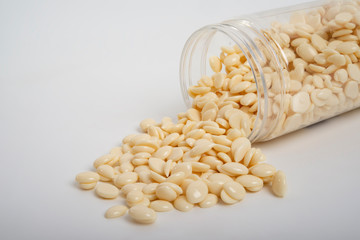 spa wax for depilation in granular form on the white background