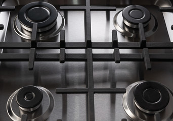 Stainless steel gas stove with black burners