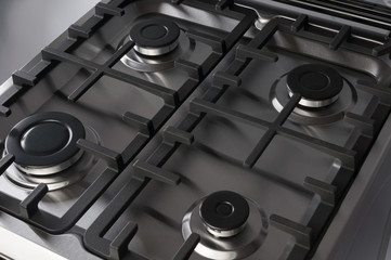 Stainless steel gas stove with black burners