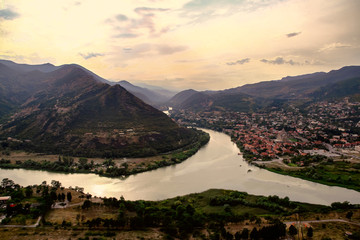 Fototapeta premium The confluence of the Aragvi and Kura rivers among the mountains near the Jvari monastery and the city of Mtskheta