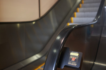 Emergency button on an escalator.