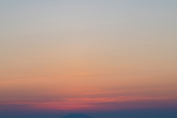 Orange horizon and blue atmosphere. Smooth orange blue gradient of dawn sky.