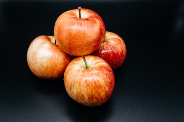 Apples on dark background close up