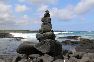 stacked lava stone on the beach