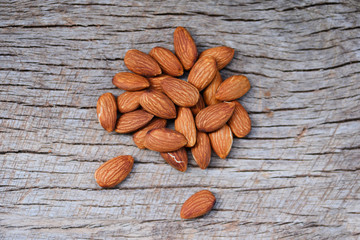 Almonds on rustic wooden background top view - Close up almond nuts natural protein food and for snack