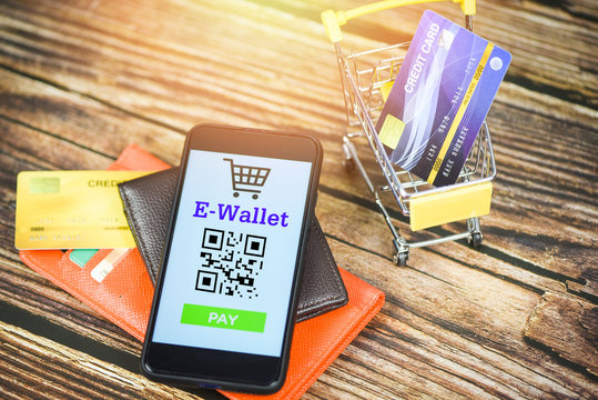 e wallet app on smartphone with credit card in shopping cart wallet  technology pay - Mobile payment online shopping concept Stock Photo | Adobe  Stock
