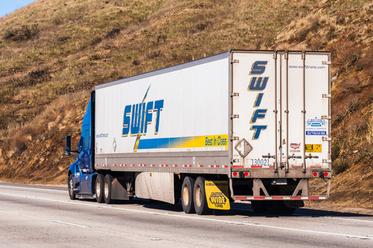 Dec 9, 2019 Los Angeles / CA / USA - Swift truck driving on the freeway; Swift Transportation is a Phoenix, Arizona-based American truckload motor shipping carrier, part of Knight-Swift