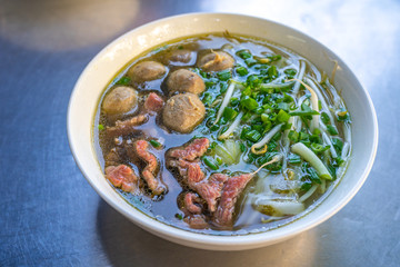 Bowl of tasty Vietnamese Pho noodle and beef meat balls