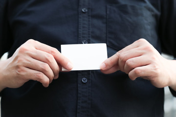 Fototapeta premium Confident male business executive with empty white business card