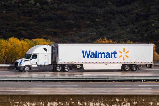 Dec 8, 2019 Los Angeles / CA / USA - Walmart Truck Driving On The Interstate, After The Rain; Wet Asphalt Visible