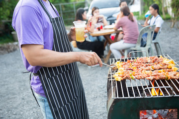 Barbeque Grill Street Food in thailand,Eat outdoors in a happy family. holiday celebration concept
