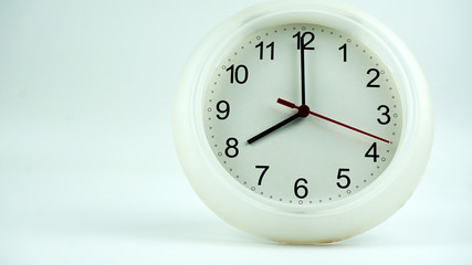 Close up white clock beginning of time 08.00 am or pm, on white background, Copy space for your text, Time concept. .