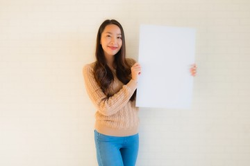 Portrait beautiful young asian women show blank white paper board