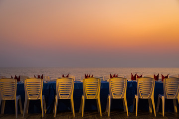 Dining table at the beach during sunset