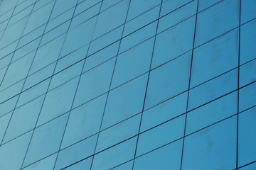 Blue glass windows of modern office building