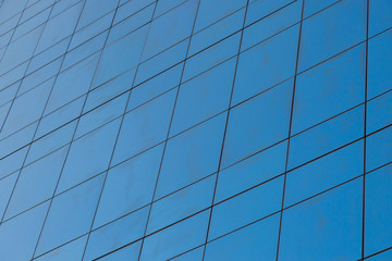 Blue glass windows of modern office building