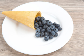 Blueberries in a waffle basket. Vitamins and wholesome foods