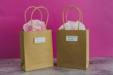original product vs dupe imitation, shopping bags with labels side by side with similar paper color