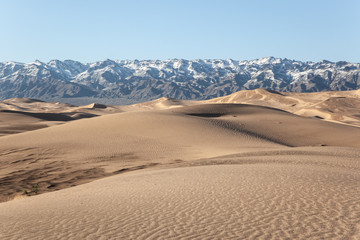 Gobi Desert Singing Sand Dunes mountain at background