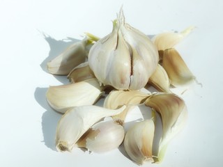 Garlic cloves on a white background