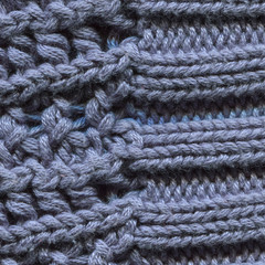 Blue knitted pullover background, close up. Knitted cloth texture of Princess Blue Color yarn. Fine-knit pure cashmere jumper. Soft blue angora background, closeup.
