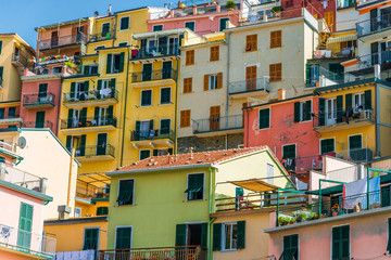 Fototapeta na wymiar Traditional colorful ancient Italian architecture houses in Manarola village, Cinque Terre