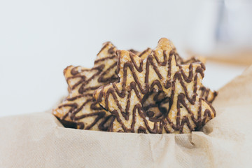Star shape cookie with chocolate and sugar on the top
