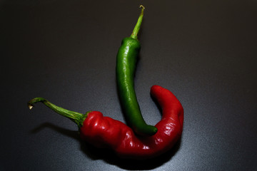 Chili peppers on a black background.
