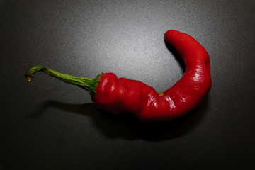Chili peppers on a black background.