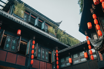 Old ancient Jinli streets of the Chengdu Chinese city, Famous tourist destination with many traditional stores. Typical Asian architecture, lanterns hanging from the roof, gardens on top. Holiday