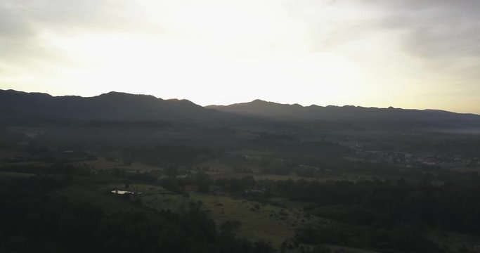 Aerial Drone view of Italian mountains in countryside during sunrise