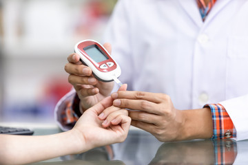 doctor checking sugar in blood patients