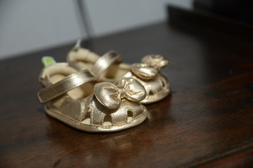 baby shoe with golden bow