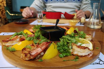 grilled shrimp. grilled fish food on a plate in a fish restaurant