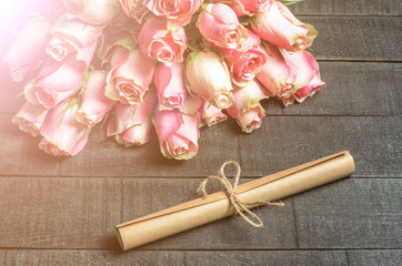 Bouquet of roses and letter scroll - 310573822