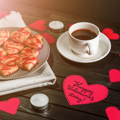 cookie-hearts, paper hearts, candles, boxes with presents and a Cup of black coffee, congratulation with Valentine's day. - 310573838