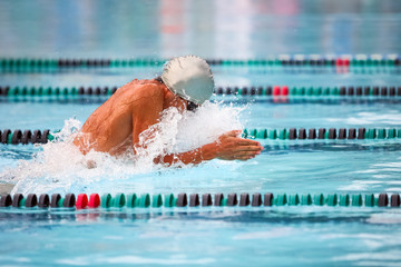 Breaststroke swimmer in a race